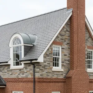 Brick Chimney Meets Slate Roof Splendor