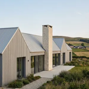 Gabled Stone Chimney Home On Hills