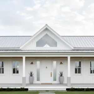Coastal Gable Farmhouse With Metal Roof
