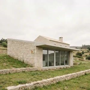 Stone Slope Retreat With Glass Front
