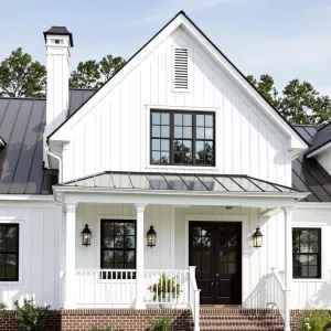 A Whimsical Welcome: Black Shutters and White Walls Unite