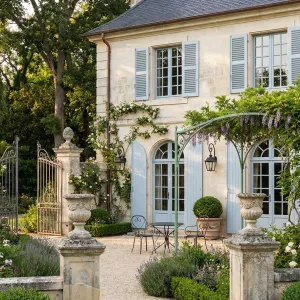 Blue Shutter Courtyard With Wisteria Welcome