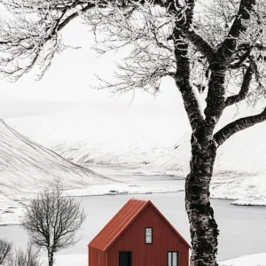Crimson Cabin in a Snowy Embrace