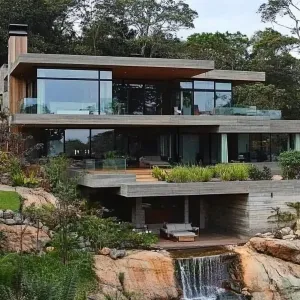 Luxurious Mountainside Retreat with a Waterfall View