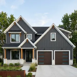 Bold Graphite Gables With Warm Timber