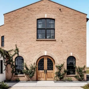 Quaint Brick Facade with Ivy Threads