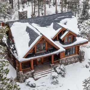 Cabin Splendor Among Snow-Topped Pines