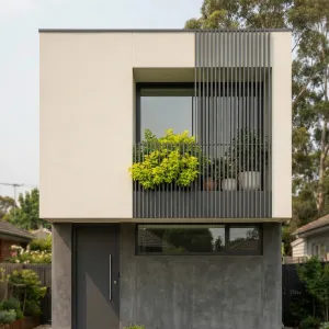 Compact Courtyard Cube With Leafy Ledge