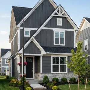 Tall Charcoal Cottage With Crisp Trim