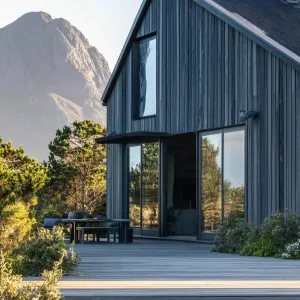 Burnt Wood Facade With Dark Grey Metal Trusses