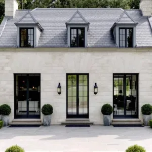 French-Jazzed Stone Bungalow in Woods