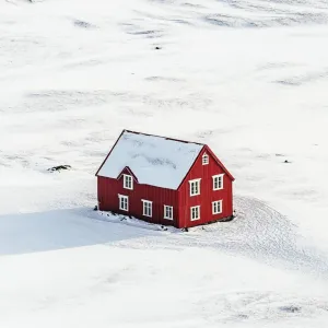 Little Red House in a Sea of White