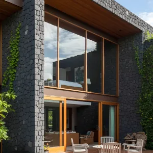 Volcanic Stone Retreat: Island Chic in Bloom