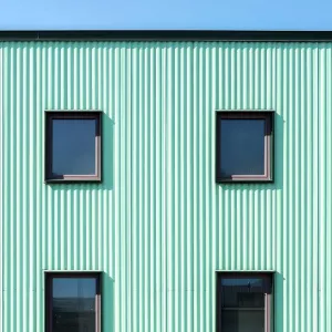 Unique Facade with Aqua Stripes