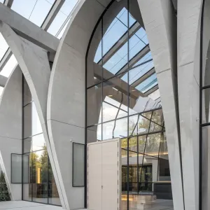 The Glass Cathedral: A Modern Arched Haven