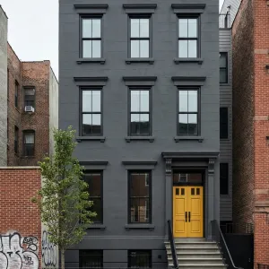 Charcoal Facade With Sunburst Entryway