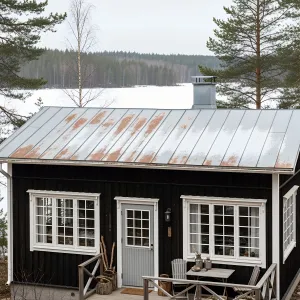Frosty Black Cabin with Charming Porch