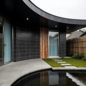 Curved Elegance: Pondside Modern Marvel